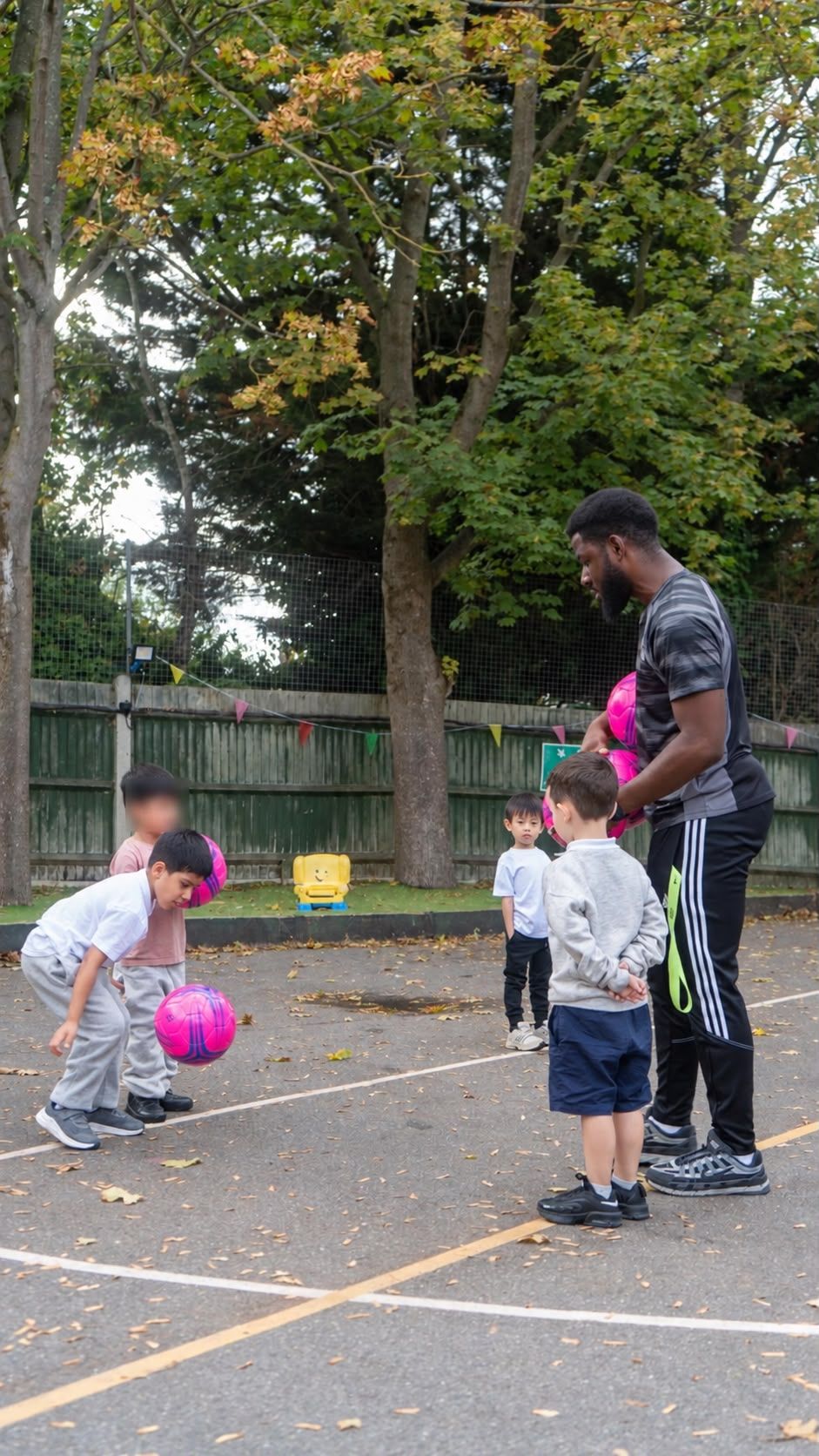 Children enjoying football coach ball at Active Minds