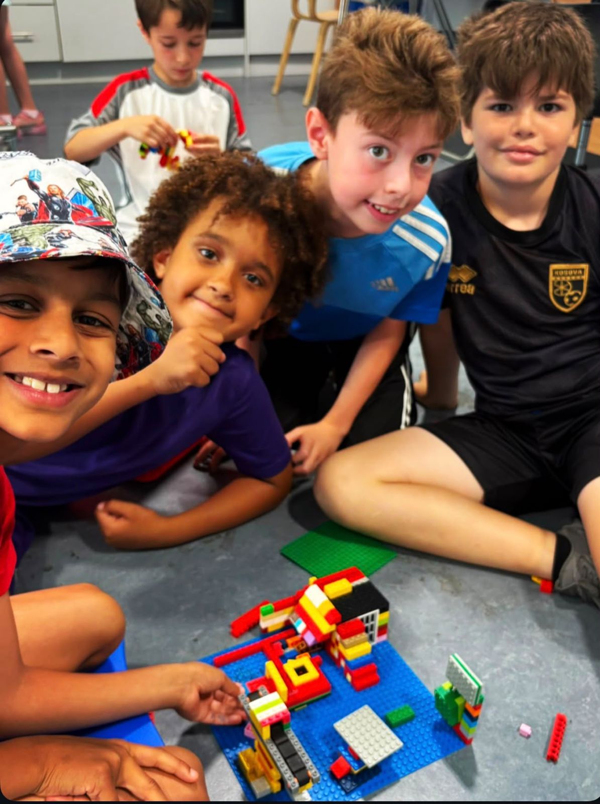 Children enjoying lego group build at Active Minds
