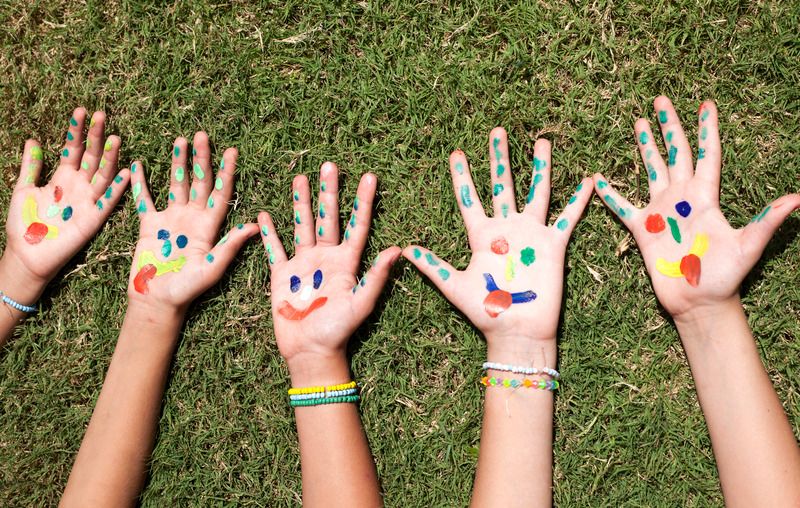 Children with colourful painted hands