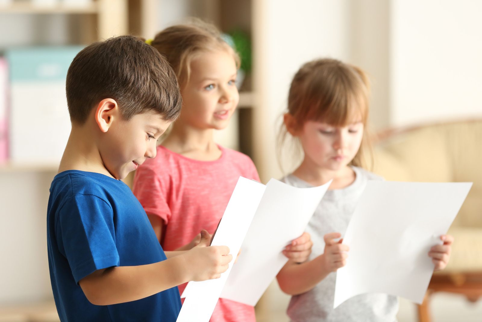 Children enjoying reading together at Active Minds
