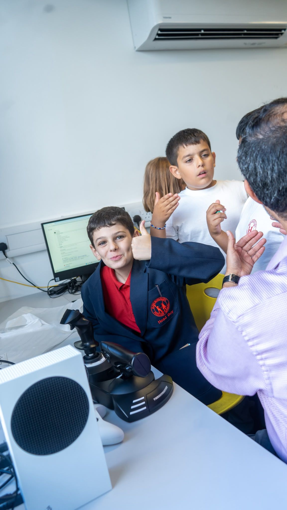 Smiling pupil at a flight simulator