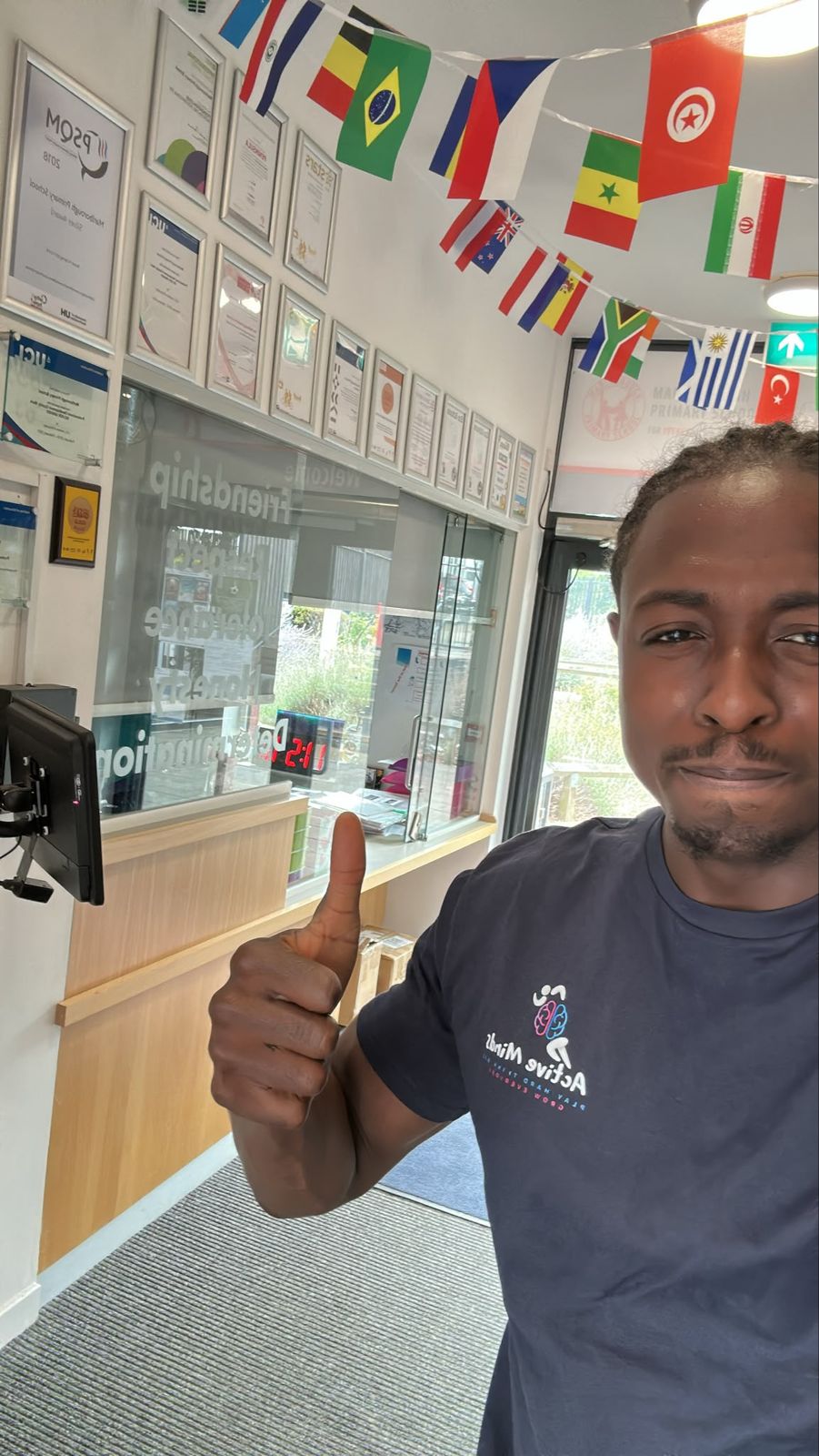Active Minds staff member in an Active Minds t-shirt giving a thumbs up