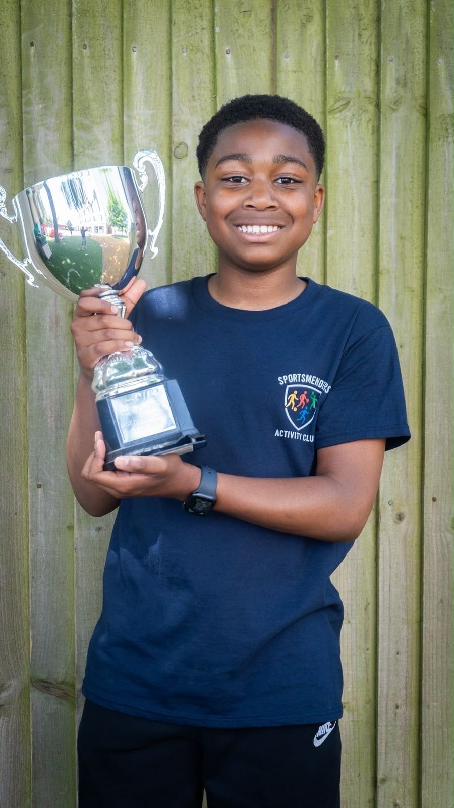 Child holding a trophy