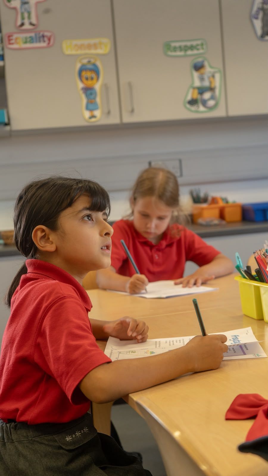 Children enjoying writing desk at Active Minds